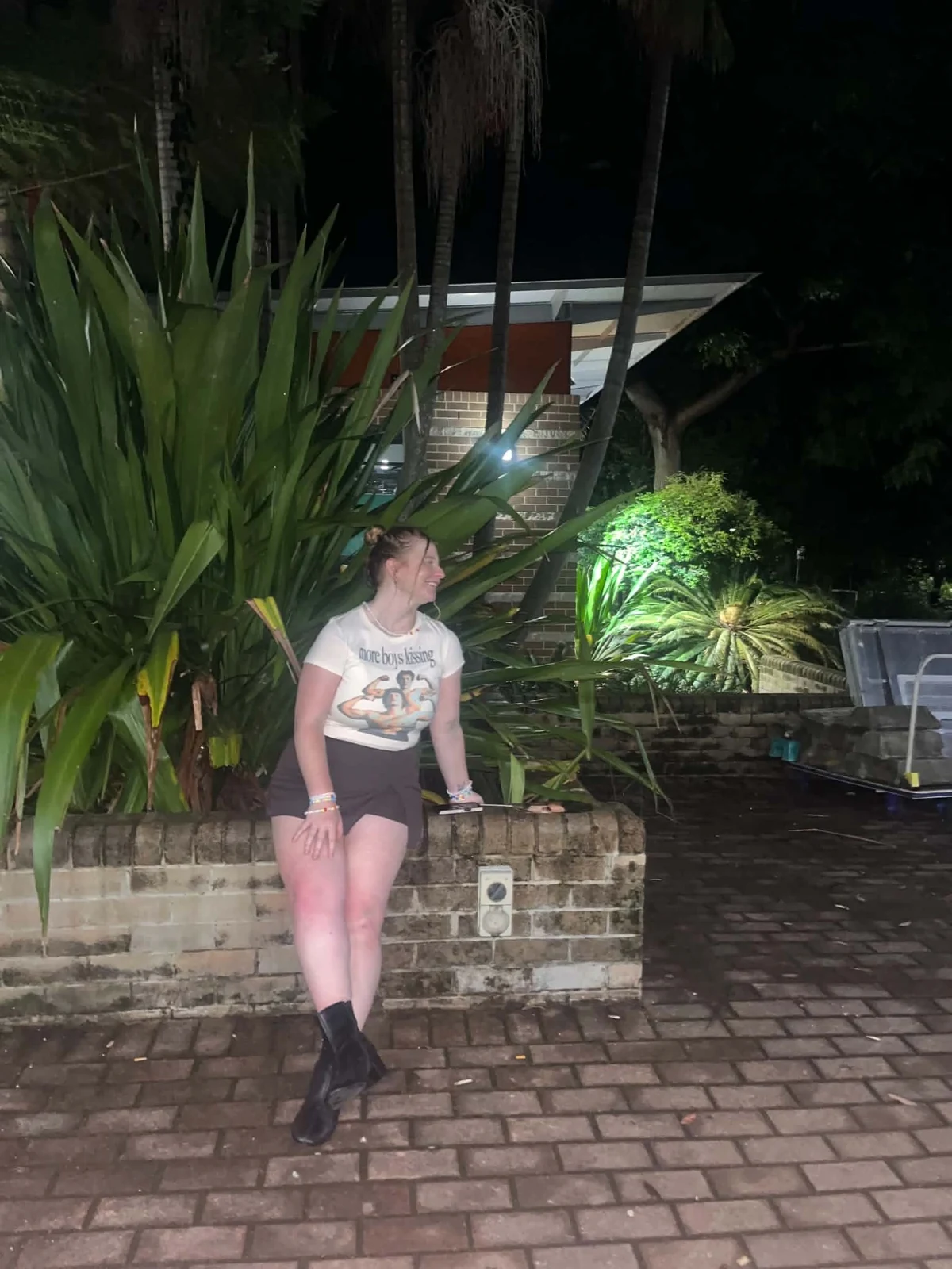 Morgan smiling outdoors at night