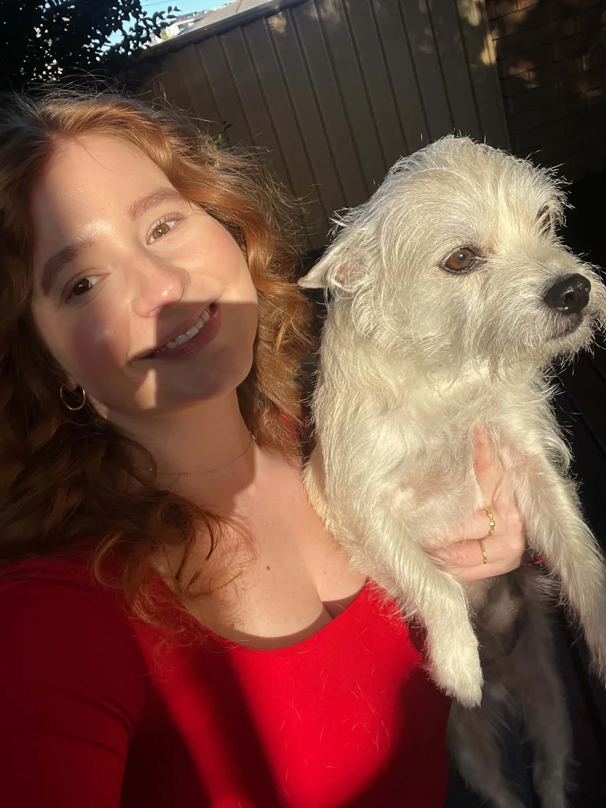 Morgan smiling with her dog Rhino